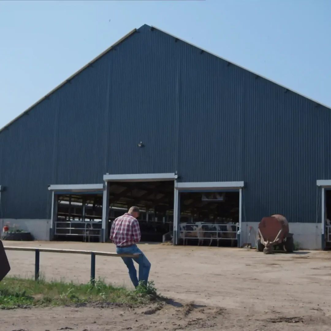 blue double slope roof steel barn