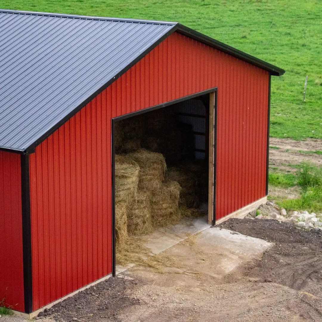 double slope red steel barn